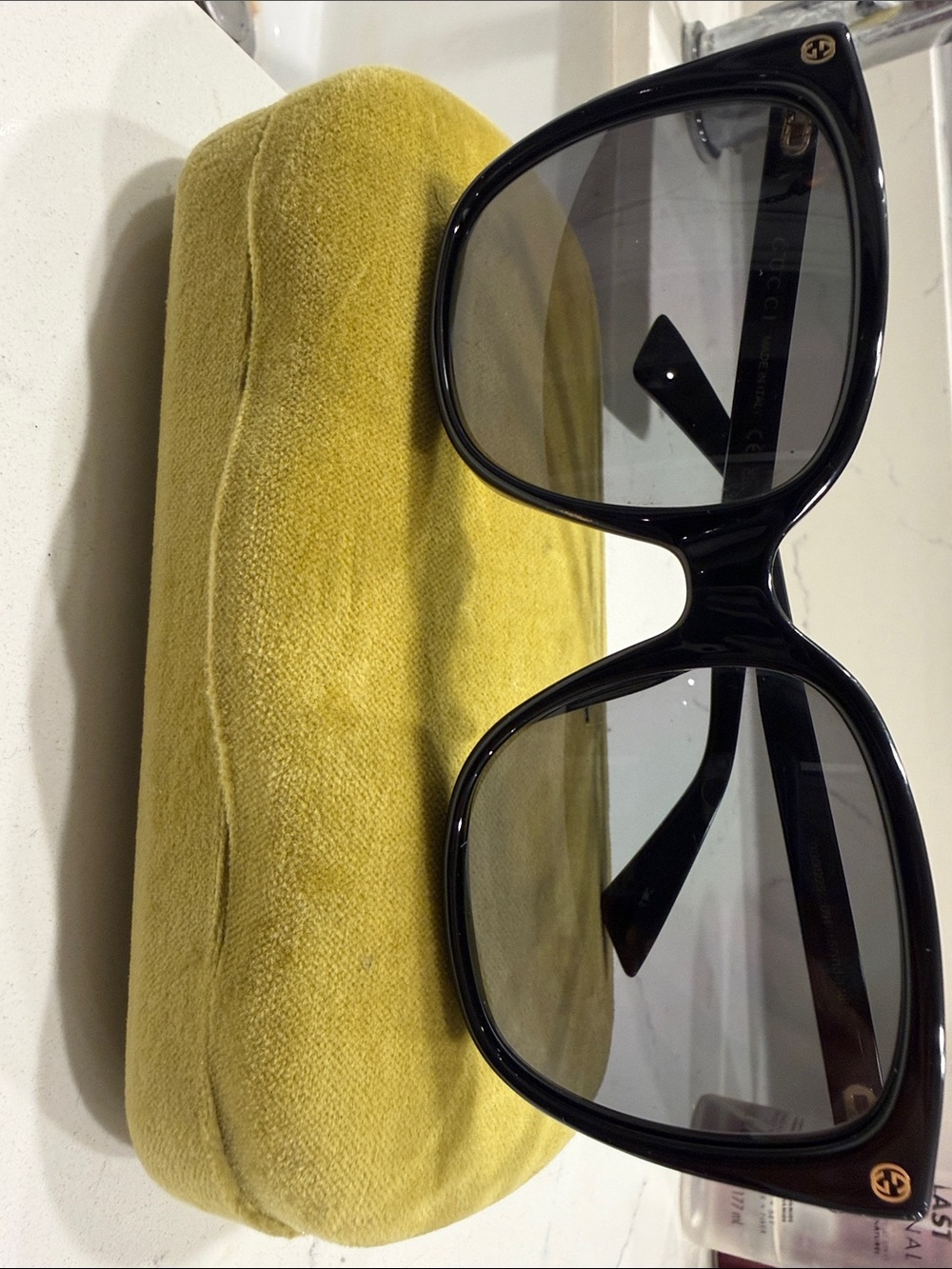 Gucci Black Cat-Eye Sunglasses with Gold Logo Accents
